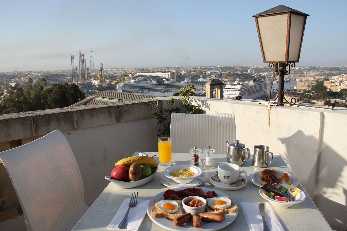 Breakfast whilst enjoying a magnificent view of the Grand Harbour